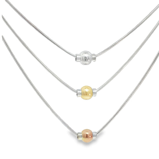 Multiple layered necklaces with colored beads on a white background