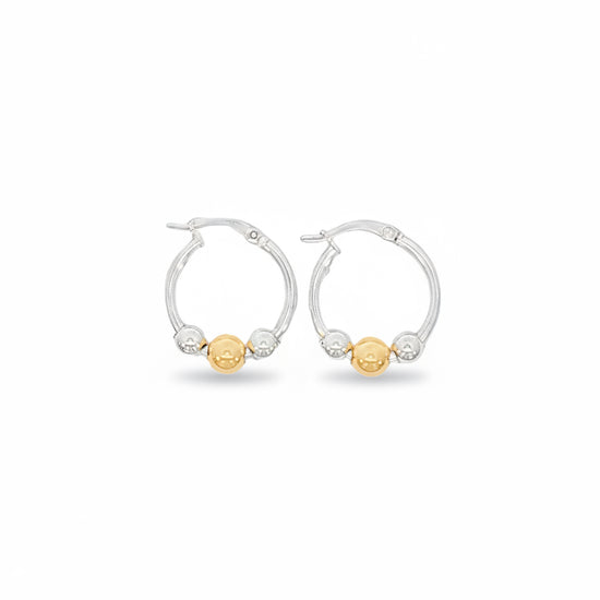 Pair of hoop earrings with gold and silver beads on a white background