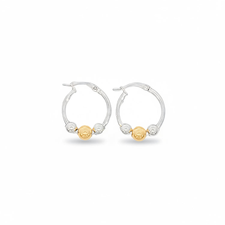 Pair of hoop earrings with gold and silver beads on a white background