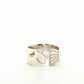 Silver fish ring with gold accent on a white background