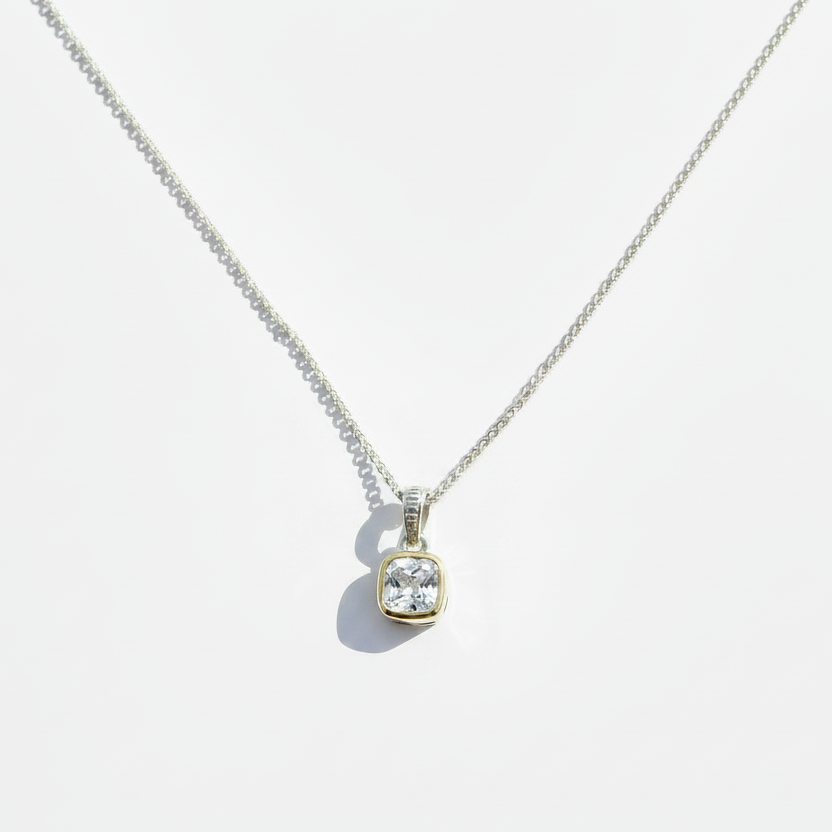 Two tone sterling silver and 14k gold necklace with clear white topaz pendant on a straight chain